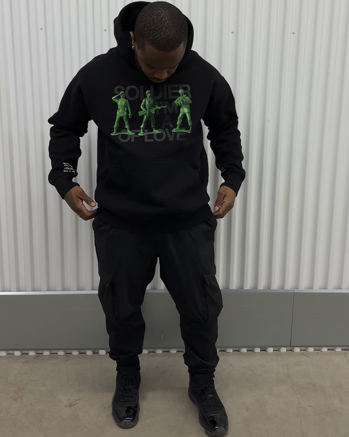 Black man in black oversized hoodie THisLIFE